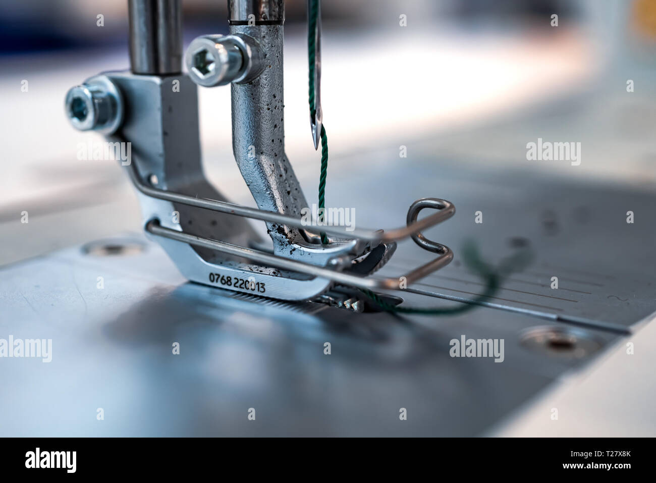 Professional sewing machine close-up. Modern textile industry. Stock Photo