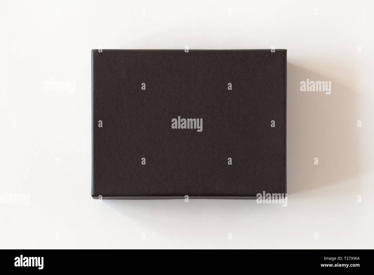Blank black closed carton box packaging isolated on white background. View above. Stock Photo
