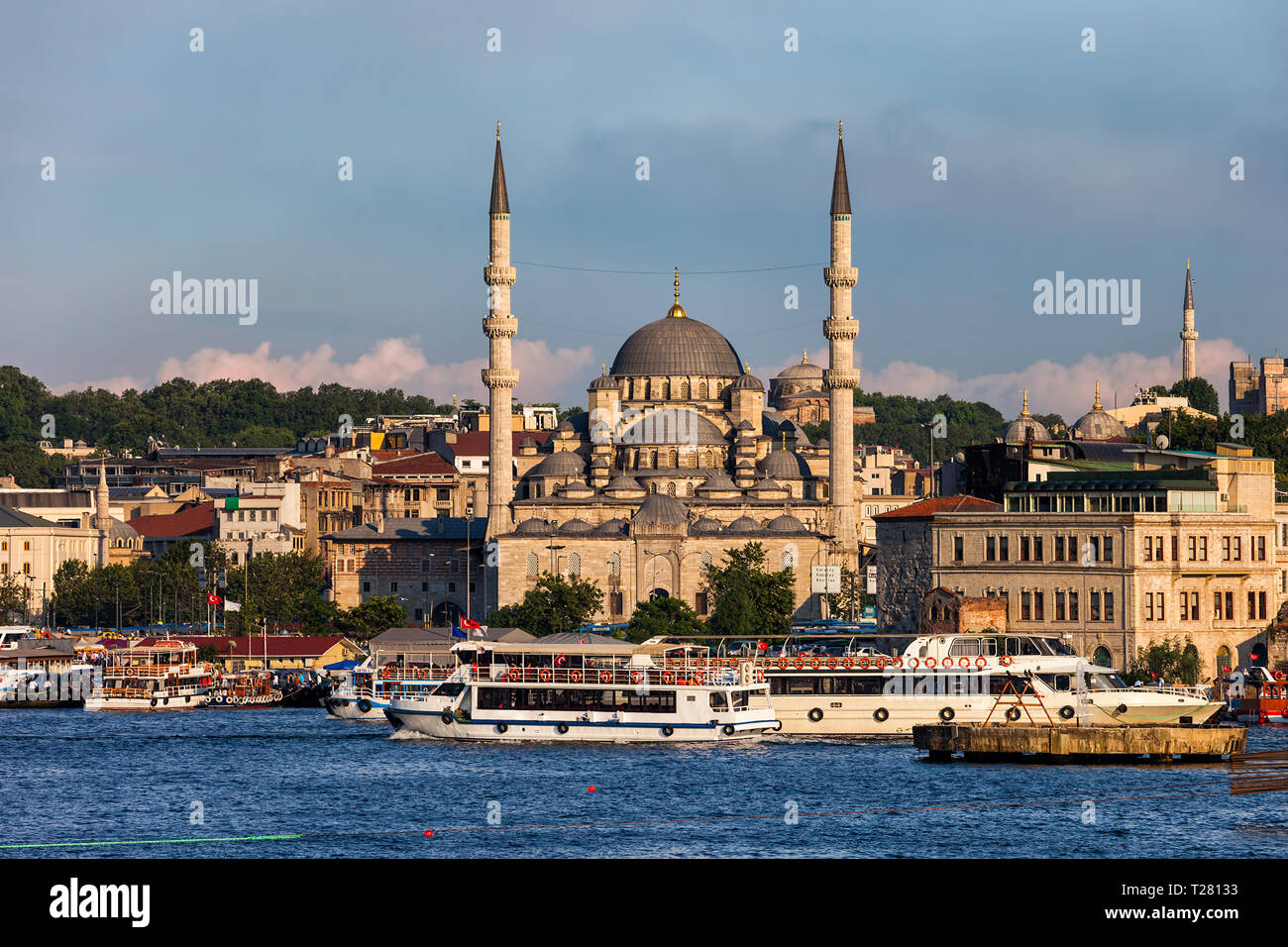 City of Istanbul in Turkey, historical Eminonu district from Golden Horn, New Valide Sultan Mosque (Turkish: Yeni Valide Sultan Camii) in the middle. Stock Photo