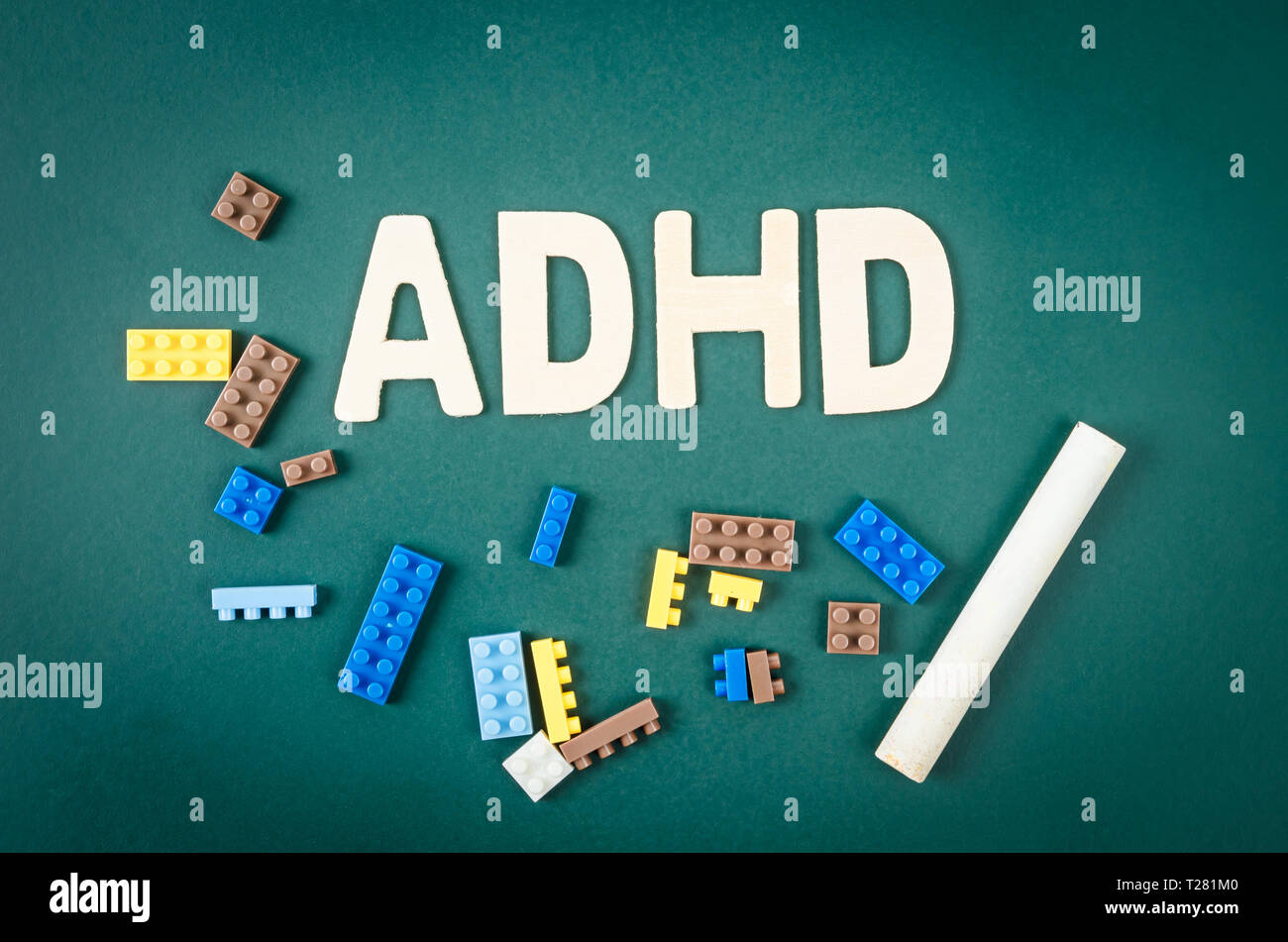 ADHD – attention deficit hyperactivity disorder concept on greenboard. Stock Photo