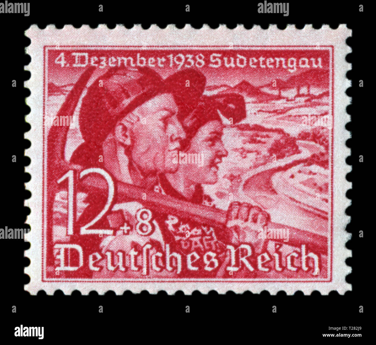 German historical stamp: Plebiscite on the accession of the Sudetenland. Couple. Miner with a pick and a woman peasant, 12+8 pf, issue 1938, Germany Stock Photo