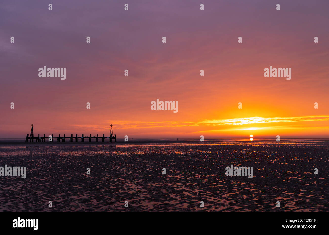 The remains of the pier's landing jetty at sunset Lytham St Annes, Lancashire, UK Stock Photo