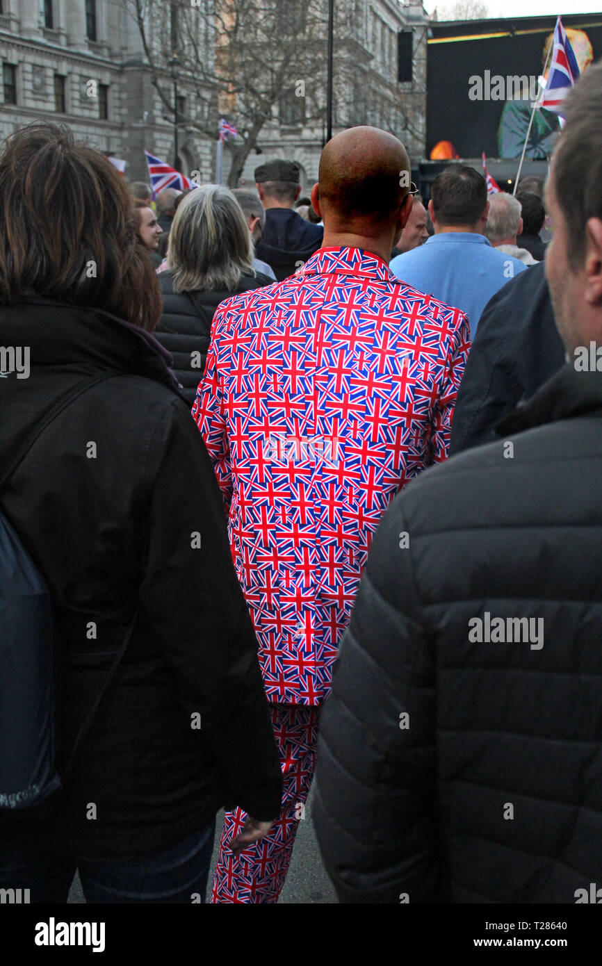 Man dressed in a Union Jack suit at the pro Brexit demonstration in Westminster, London - March 2019 Stock Photo