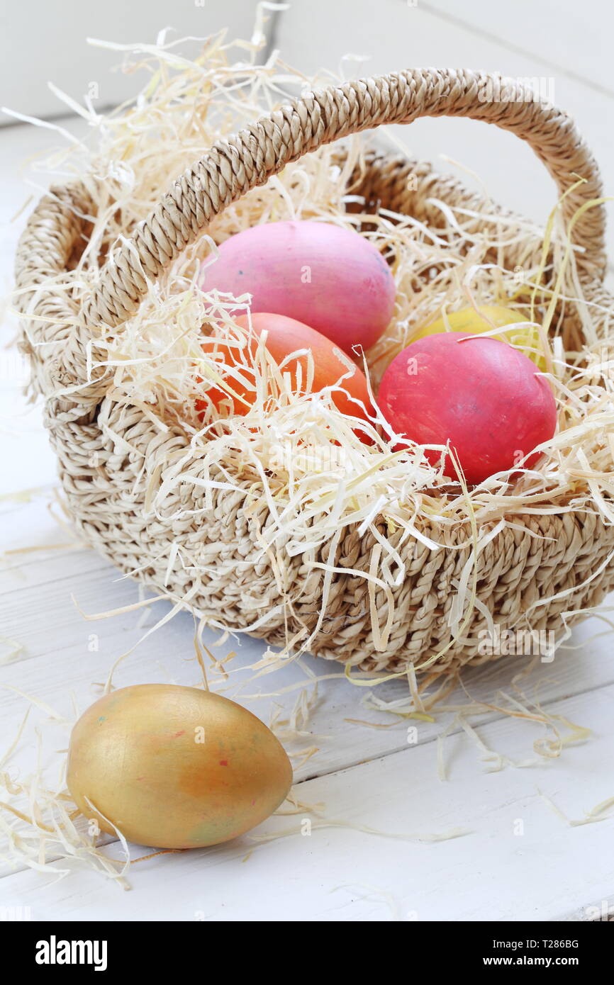 Easter still life with painted eggs and flowers on a white background ...