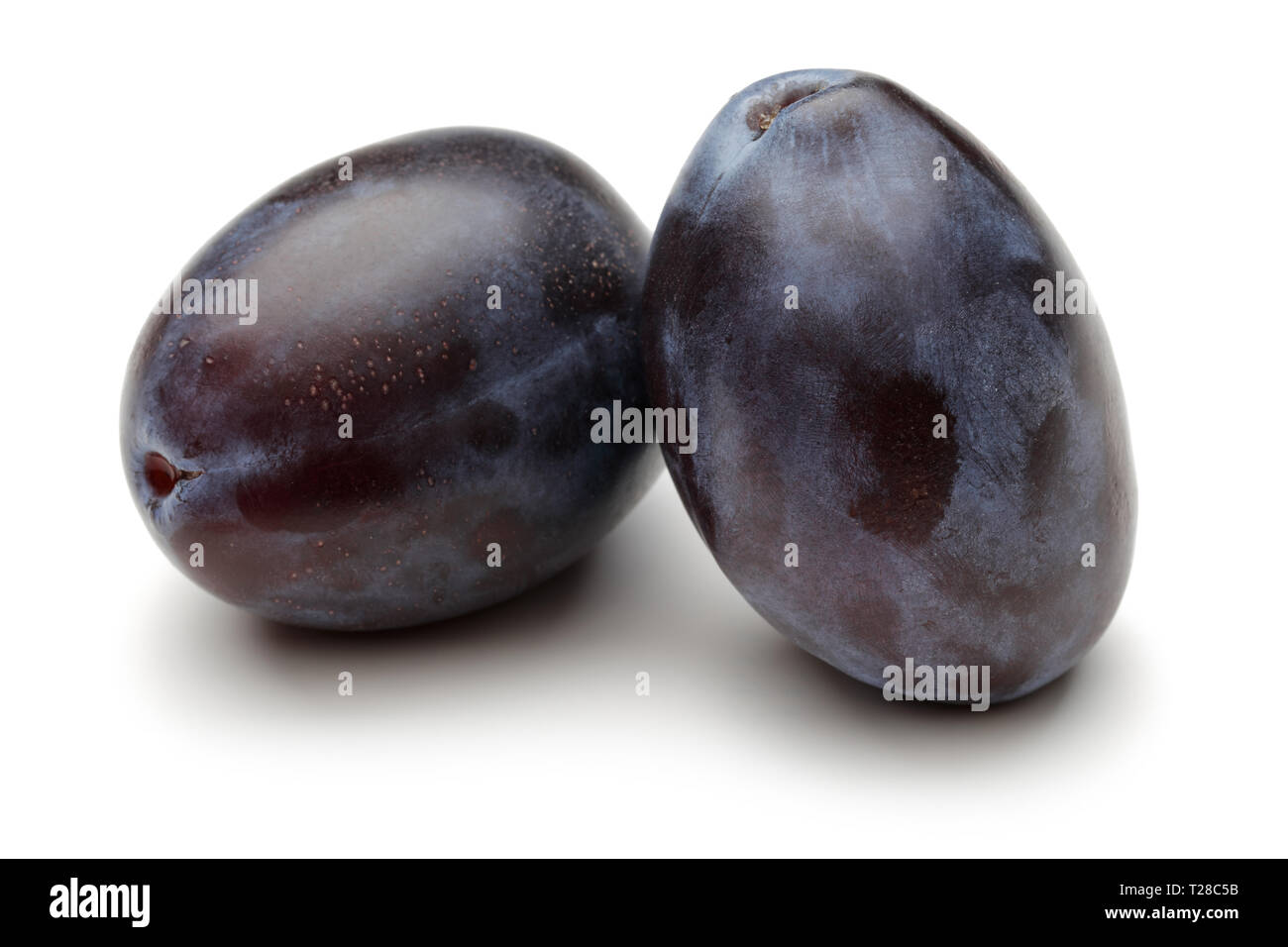Two whole Damson plums isolated on white background Stock Photo