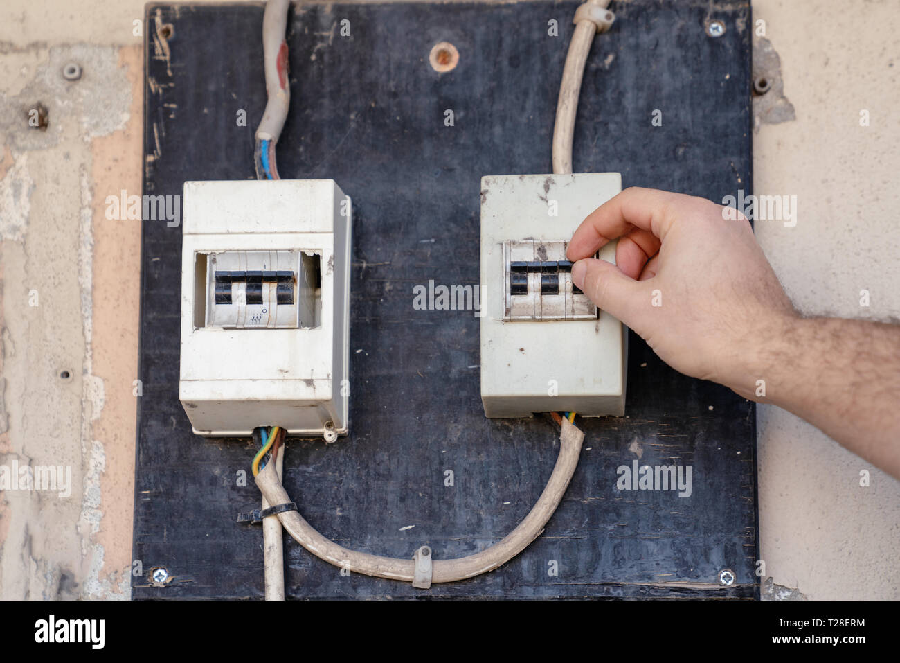 Electrician check or Inspect Electrical System circuit Breaker on Power Distribution panel. Stock Photo