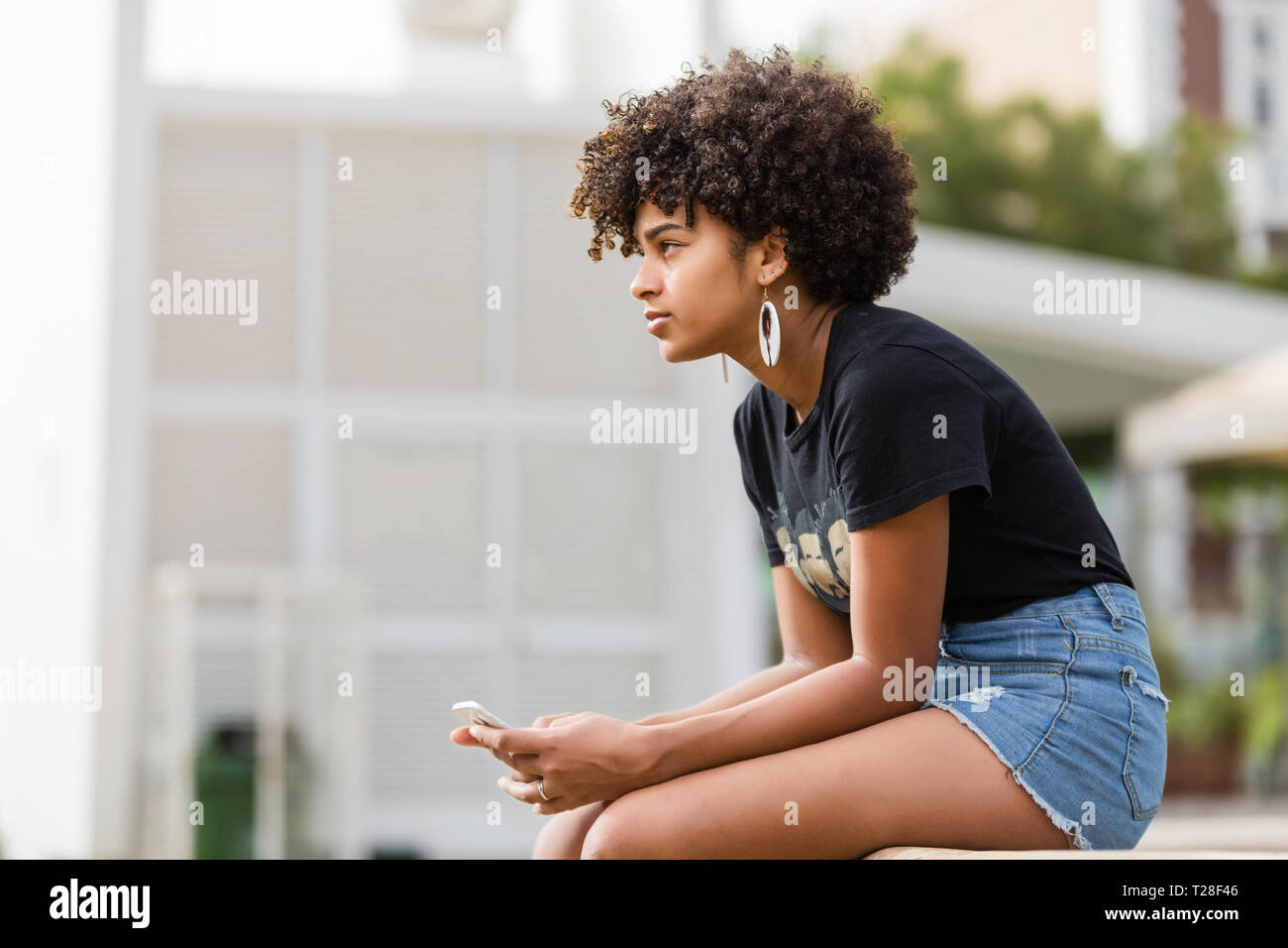 Outdoor portrait of a Young black African American young woman speaking ...