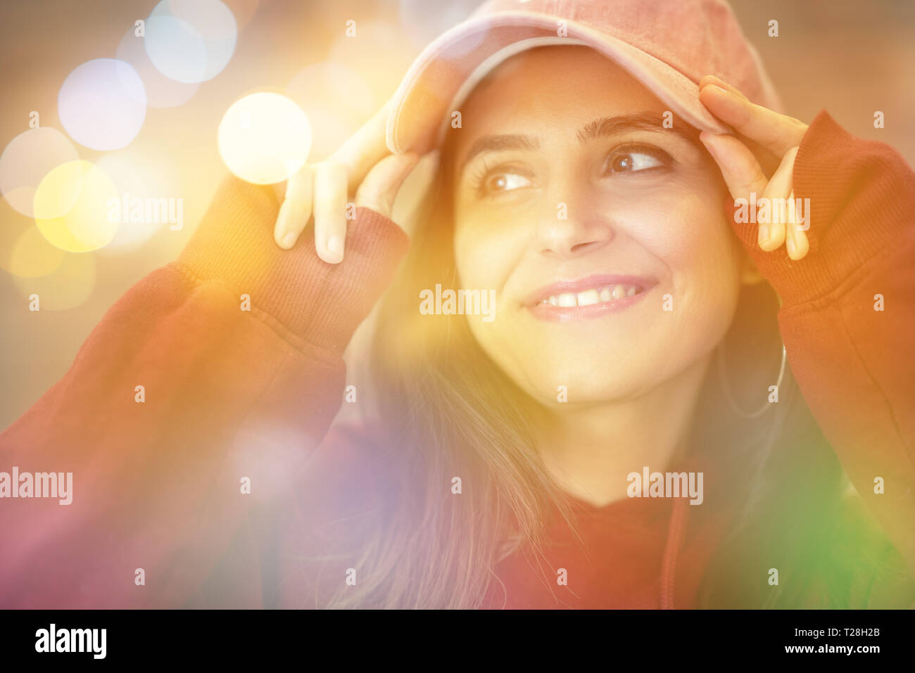 Portrait of beautiful woman enjoying near window with blurry background Stock Photo