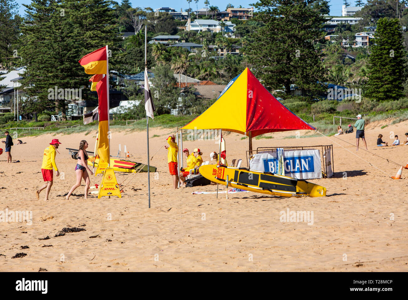 Surf rescue volunteers on Newport beach in Sydney,Australia with red