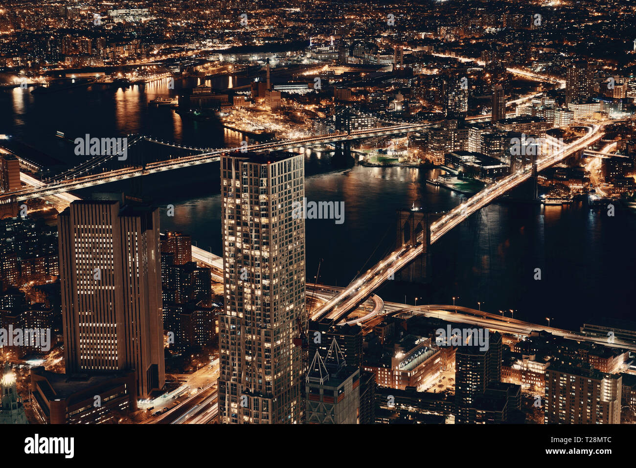 Rooftop night view of New York City downtown with urban skyscrapers ...