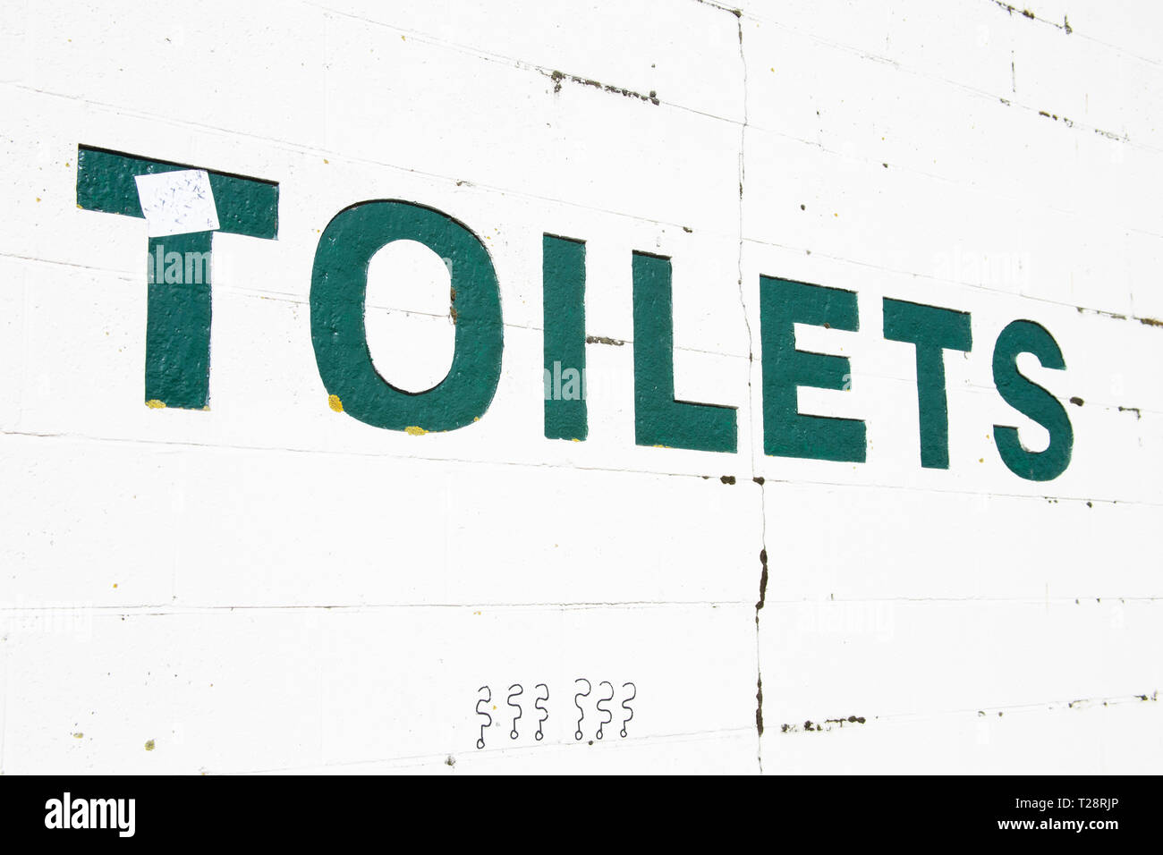 Public toilets. Sign painted on wall Stock Photo Alamy