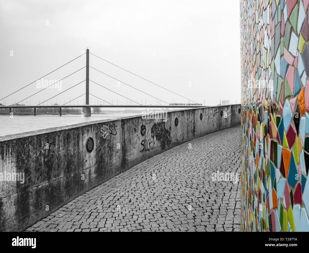 Düsseldorf, Germany, 23 March 2019. Colorful Mosaic agasinst the backdrop of modernist architecture and bridge on the bank of river Rhine. Stock Photo