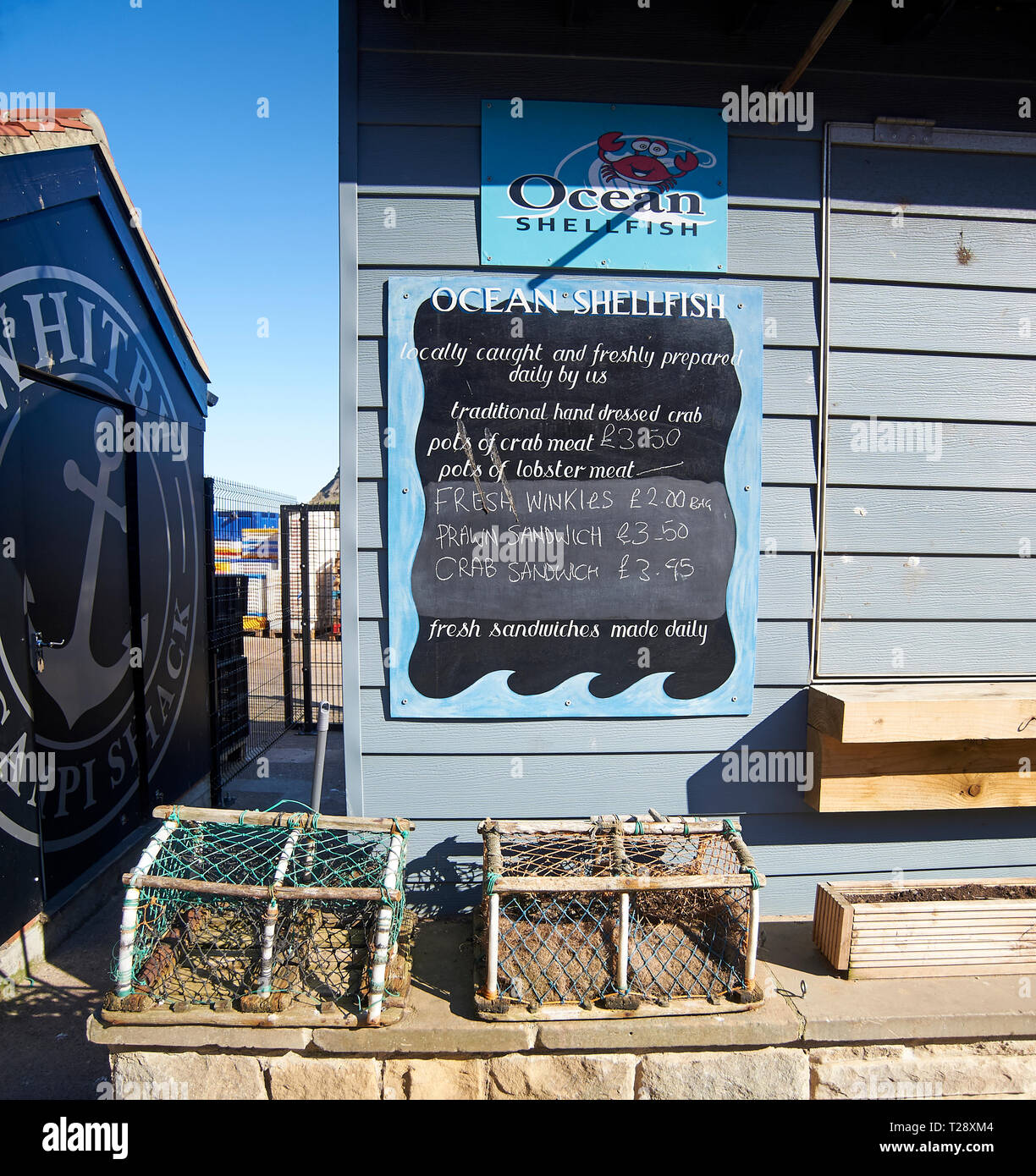 Seafood sign selling crab and lobster sandwiches on Whitby seafront