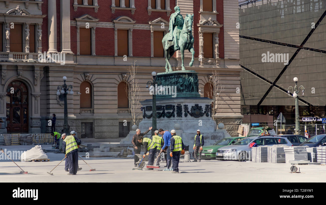 Belgrade, Serbia, March 2019 - Construction workers paving the Republic Square (Trg republike) in the city center Stock Photo