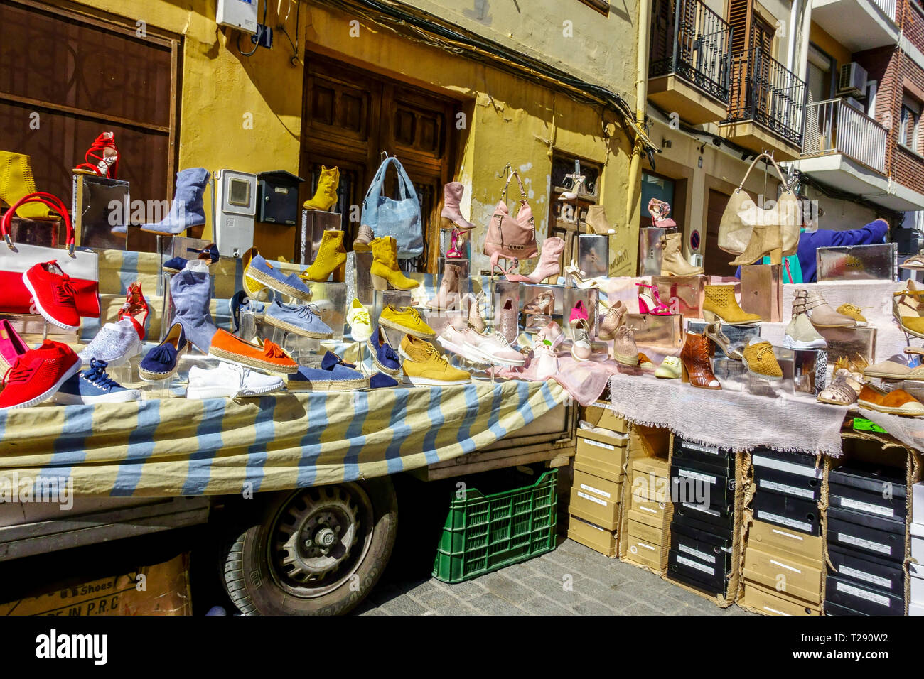 Every Thursday on the streets is a traditional market, Valencia street scene Cabanyal Canyamelar district  Spain, Shoe stall Valencia market outdoor Stock Photo