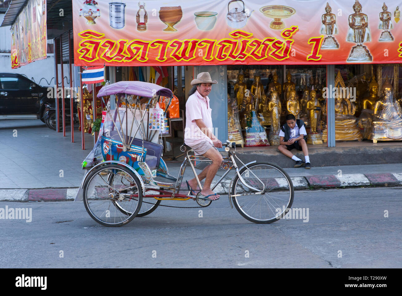 Rickshaw rider, Chiang Rai, Thailand Stock Photo