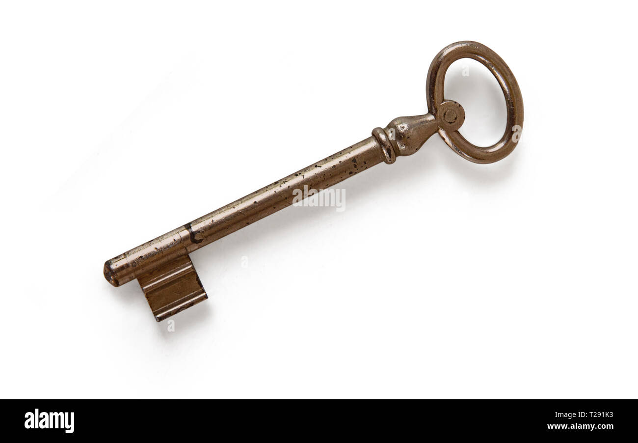 Old rusty door key isolated on white. With clipping path Stock Photo