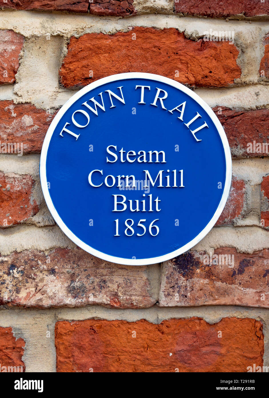 A Blue Plaque marking the Town Trail for the site of the Steam Corn