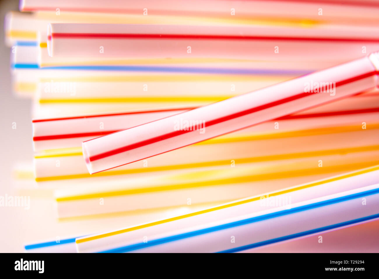Background of Colored plastic straws. Macro shot. Use of plastic straps