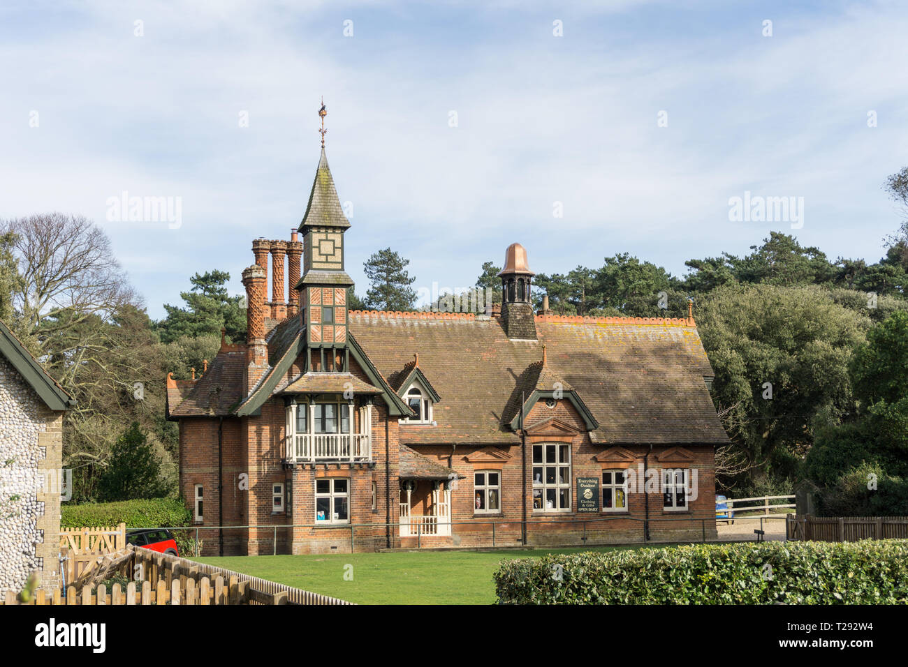 The old Reading Room in the estate village of Holkham, North Norfolk, UK, now the home to Everthing Outdoor, a clothing shop. Stock Photo