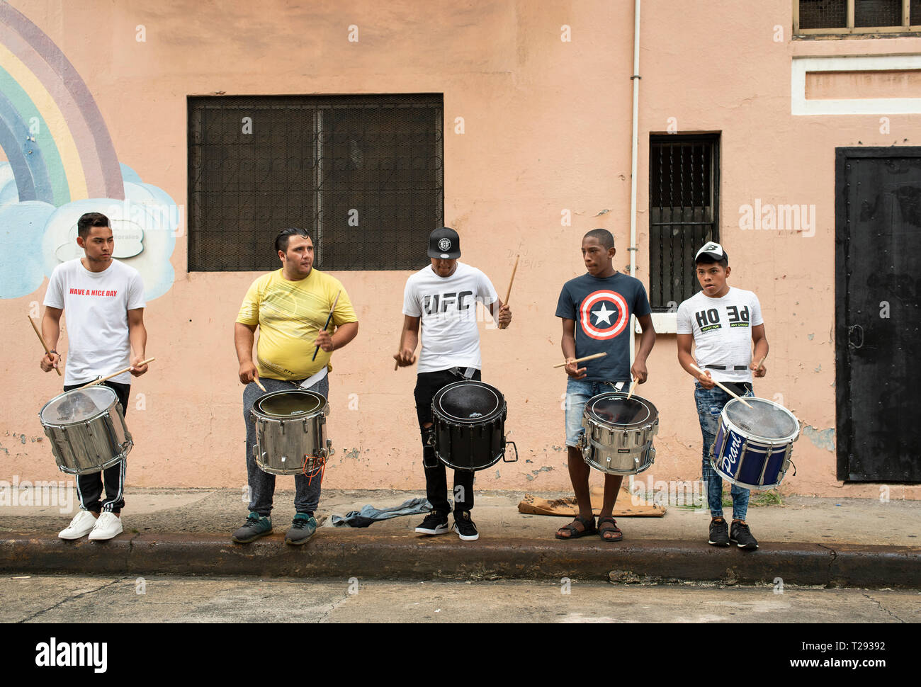 Young musicians rehearsing percussion with surdos (marching snare drum) on Sunday afternoon in downtown Panama City. Panama, Central America. Oct 2018 Stock Photo