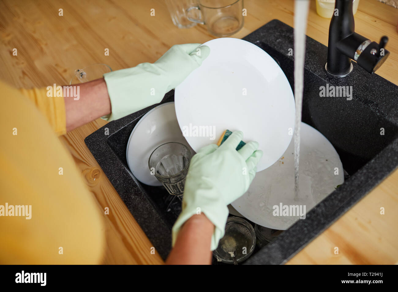 Hand washing dishes Stock Photo