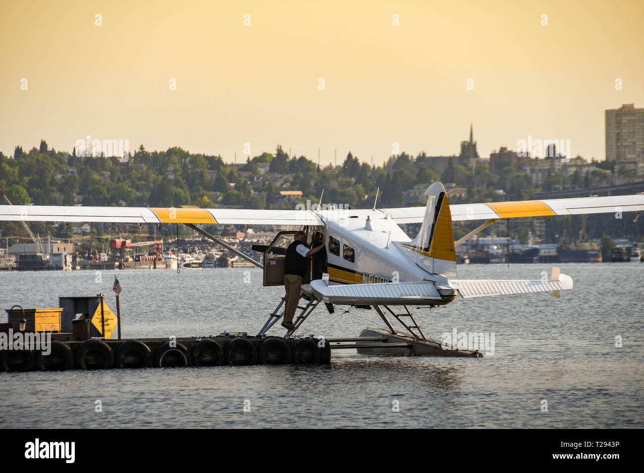 SEATTLE WA, USA - JUNE 2018: Pasengers boarding a De Havilland Beaver float plane operated by Kenmore Air leaving the seaplane terminal in Seattle Stock Photo