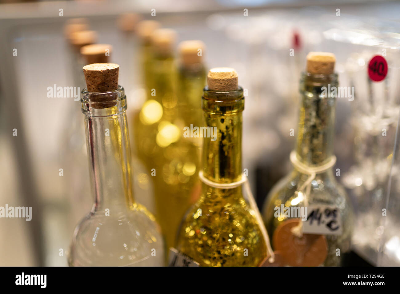 Yellow and white glass bottles in a shop Stock Photo Alamy