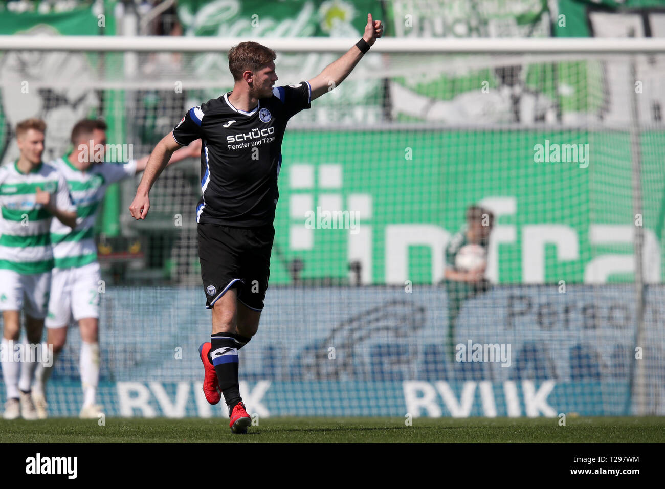 Furth, Germany. 31st Mar, 2019. Soccer: 2nd Bundesliga, SpVgg Greuther Fürth - Arminia Bielefeld, 27th matchday, at the Sportpark Ronhof Thomas Sommer. Fabian Klos from Bielefeld cheers on his goal to 2:1. Photo: Daniel Karmann/dpa - IMPORTANT NOTE: In accordance with the requirements of the DFL Deutsche Fußball Liga or the DFB Deutscher Fußball-Bund, it is prohibited to use or have used photographs taken in the stadium and/or the match in the form of sequence images and/or video-like photo sequences. Credit: dpa picture alliance/Alamy Live News Credit: dpa picture alliance/Alamy Live News Stock Photo