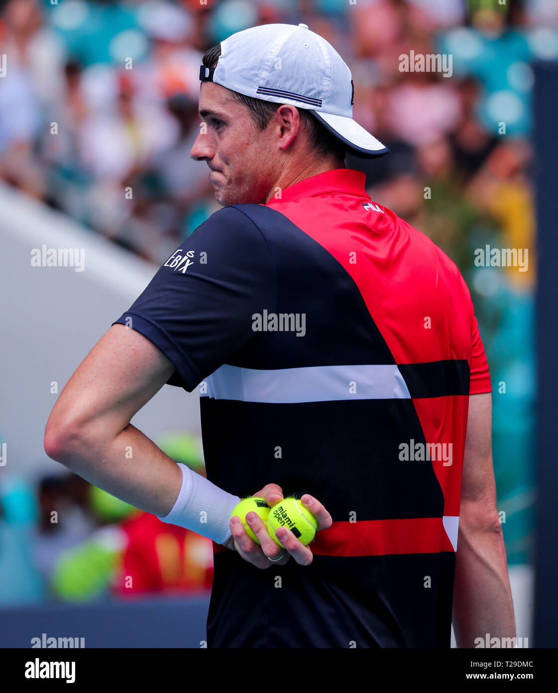 Miami Gardens, Florida, USA. 31st Mar, 2019. John Isner, of the United States, looks in pain during his match against Roger Federer, of Switzerland, in the Men's Singles final of the 2019 Miami Open Presented by Itau professional tennis tournament, played at the Hardrock Stadium in Miami Gardens, Florida, USA. Federer won 6-1, 6-4. Mario Houben/CSM/Alamy Live News Stock Photo