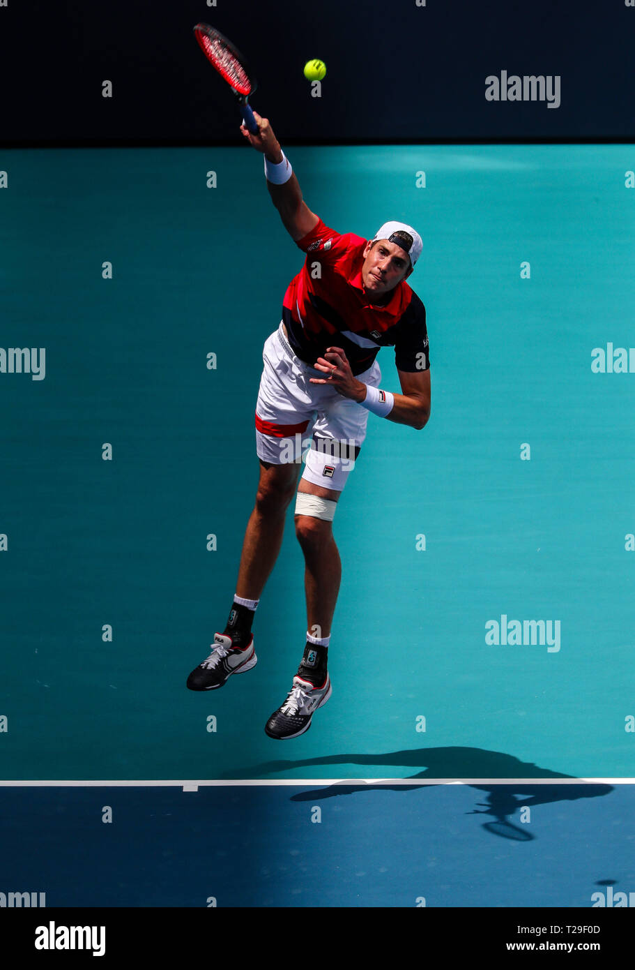Miami Gardens, Florida, USA. 31st Mar, 2019. John Isner, of the United States, serves against Roger Federer, of Switzerland, in the Men's Singles final of the 2019 Miami Open Presented by Itau professional tennis tournament, played at the Hardrock Stadium in Miami Gardens, Florida, USA. Federer won 6-1, 6-4. Mario Houben/CSM/Alamy Live News Stock Photo