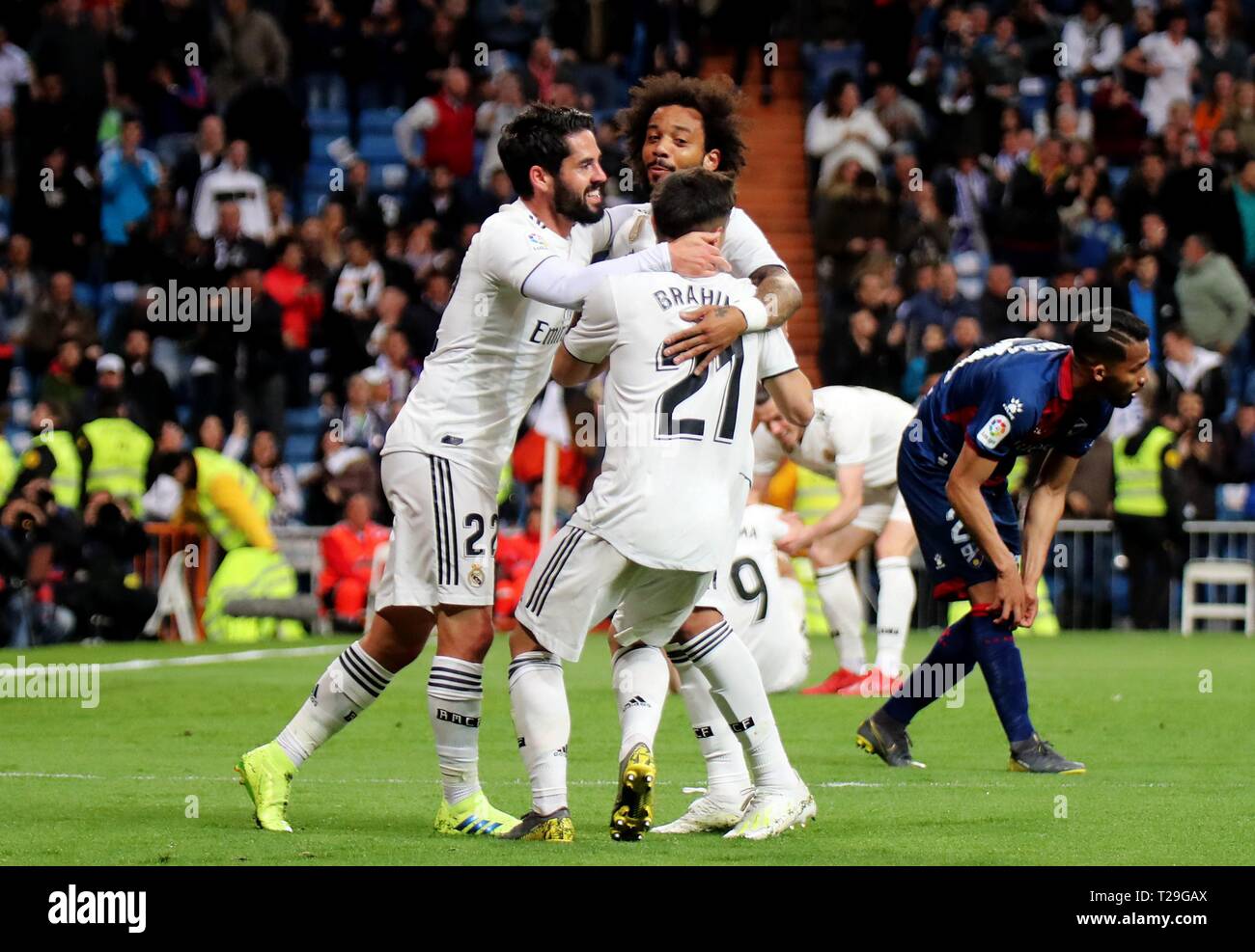 Madrid, Spain. 31st Mar, 2019. Real Madrid's Isco (1st L), Marcelo (2nd L) and Brahim Diaz (3rd L) celebrate during a Spanish league soccer match between Real Madrid and Huesca in Madrid, Spain, on March 31, 2019. Real Madrid won 3-2. Credit: Edward F. Peters/Xinhua/Alamy Live News Stock Photo