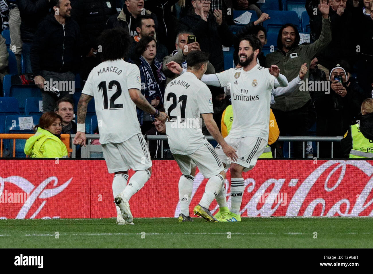 Real Madrid's (L-R) Marcelo Vieira, Brahim Diaz and Francisco Alarcon 'Isco' celebrate goal during La Liga match between Real Madrid and SD Huesca at Santiago Bernabeu Stadium in Madrid, Spain. Final score: Real Madrid 3 - SD Huesca 2. Stock Photo