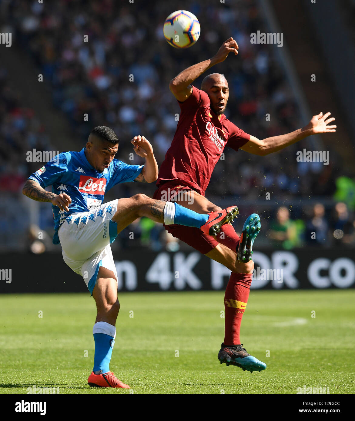 Rome, Italy. 31st Mar, 2019. Napoli's Allan (L) vies with Roma's Steven Nzonzi during a Serie A soccer match in Rome, Italy, March 31, 2019. Napoli won 4-1. Credit: Alberto Lingria/Xinhua/Alamy Live News Stock Photo