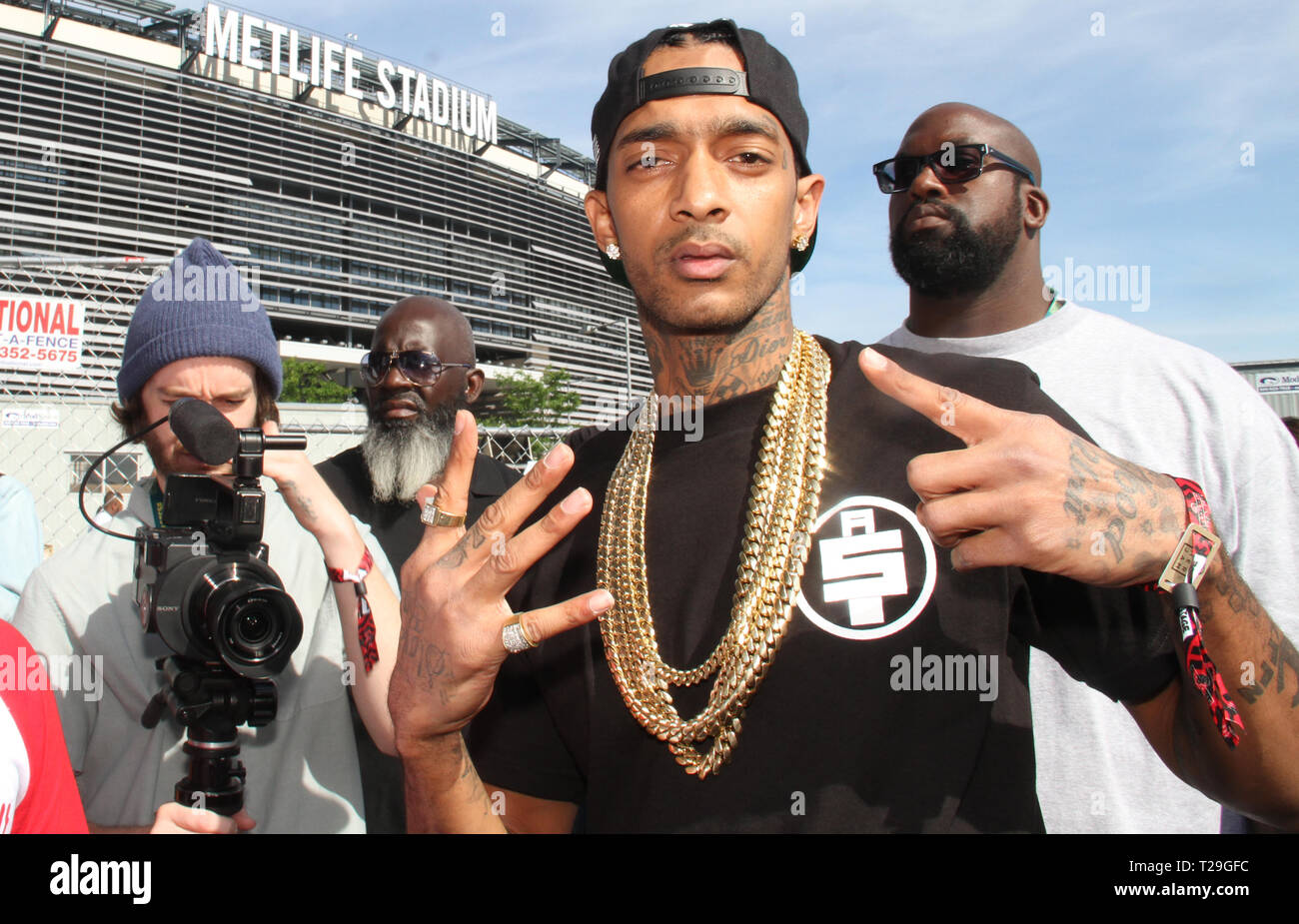 FILE PICS: Rapper Nipsey Hussle killed in shooting outside his clothing store in Los Angeles. East Rutherford, NJ - June 1, 2014 Nipsey Hussle attends the Hot 97 Summer Jam 2014 concert at Metlife Stadium, June 1, 2014 in East Rutherford, NJ Walik Goshorn/MediaPunch Credit: MediaPunch Inc/Alamy Live News Stock Photo