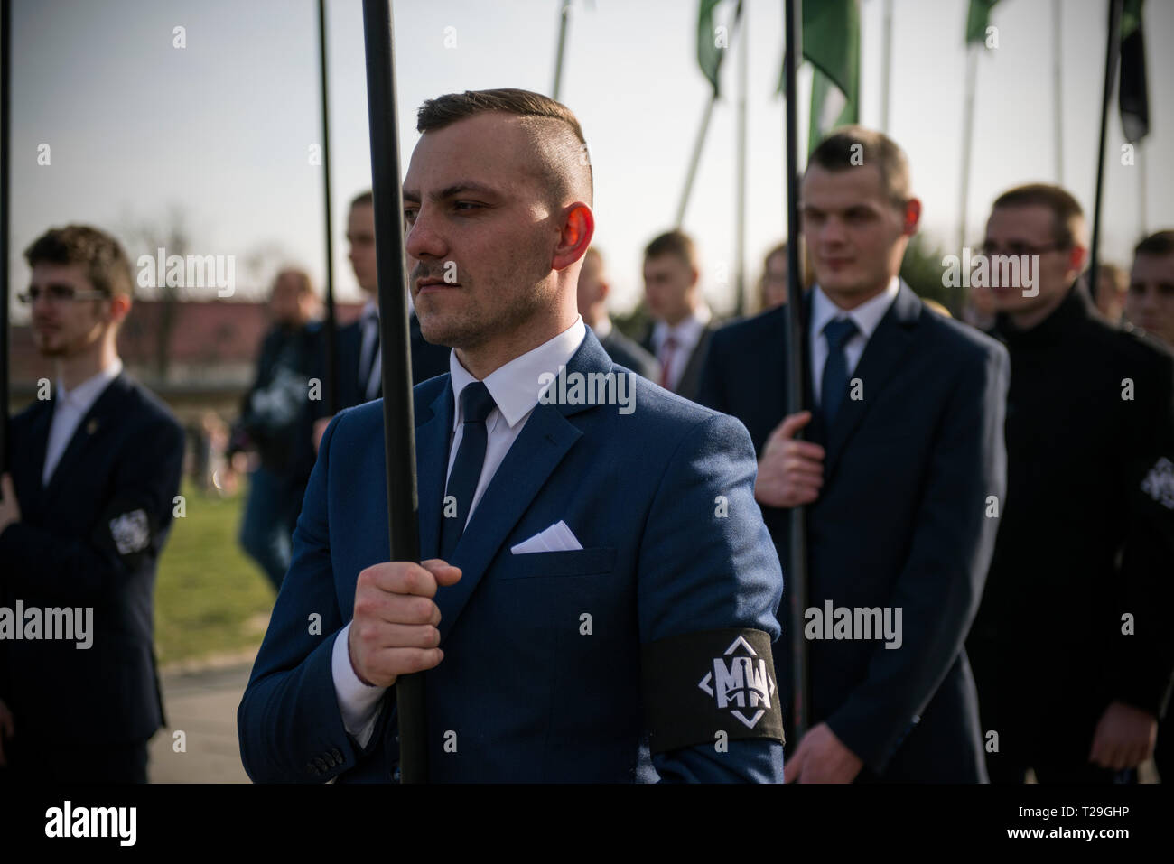 A nationalist with the All-Polish Youth arm band is seen standing in a formation during the pilgrimage. The 6th Pilgrimage of Nationalists at the Jasna Gora monastery organized by the All-Polish Youth (Mlodziez Wszechpolska). This pilgrimage is under the patronage of the Pozna? Five, meaning five young boys who gave their lives for God and for their homeland. Stock Photo