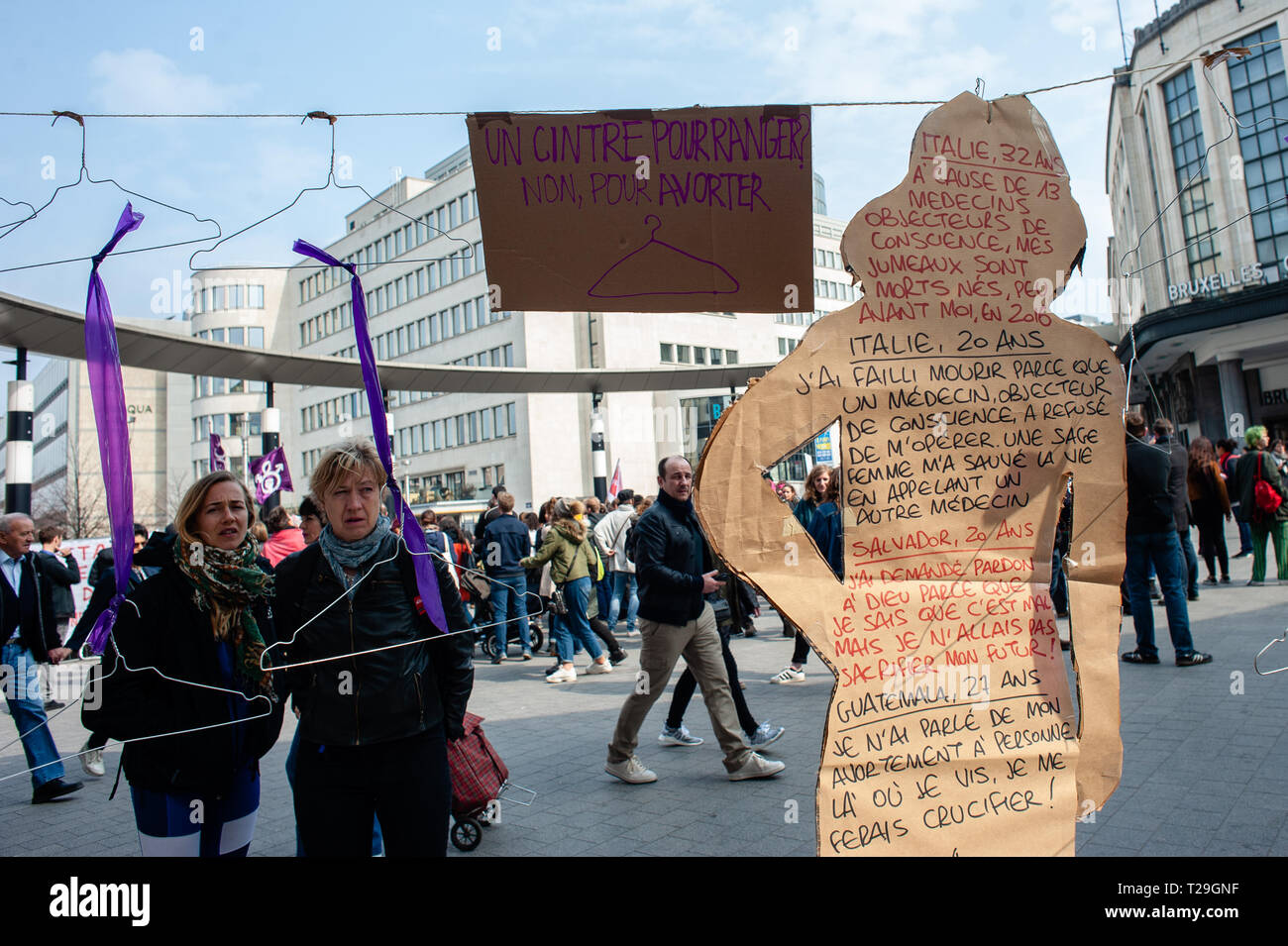 A collective installation honouring women who died from an unsafe abortion is seen hanging around the central station during the Defend abortion right protest. At the same time that a March for life was celebrated in Brussels, the Belgian collective organized a 'Defend abortion right' demonstration at the Brussels central station. Since October 2018 in Belgium, abortion is no longer regulated by the penal code but by the civil code. Just before the final vote in September 2018, several thousand people had walked the streets of Brussels to demand real decriminalization of abortion. The organiza Stock Photo