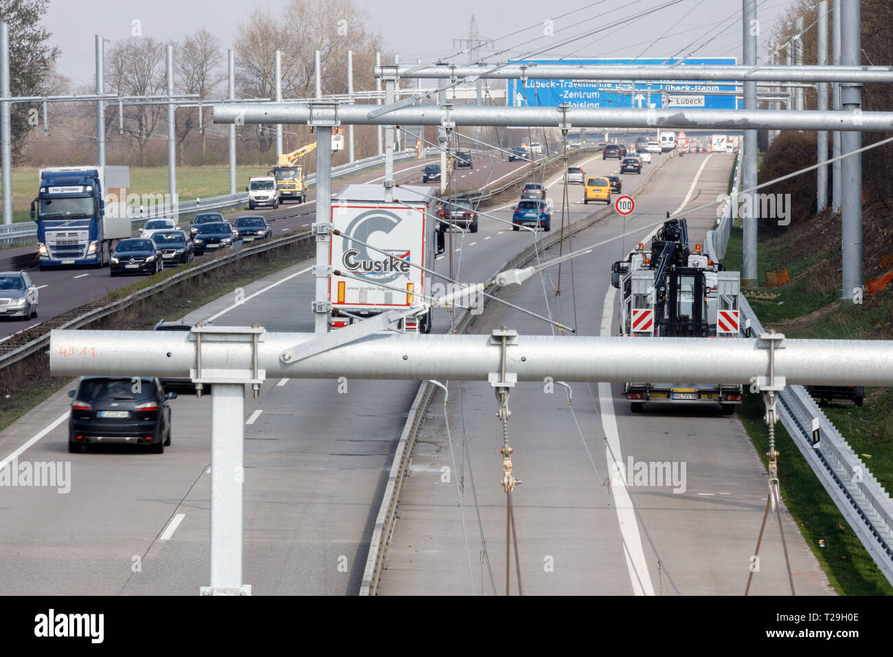 Reinfeld, Germany. 30th Mar, 2019. Cars and trucks drive past newly ...