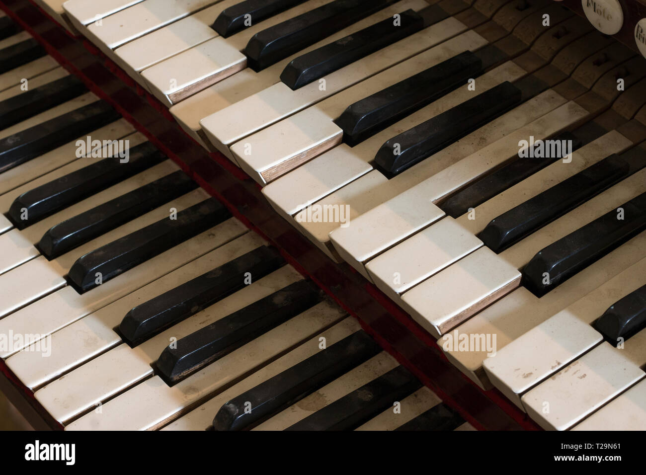 Detail of old, damaged and dusty organ keys Stock Photo