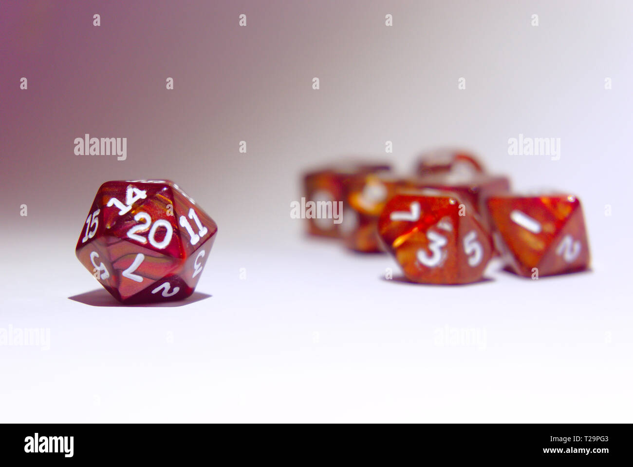 different brown dices isolated with white background. dices are often used for role playing board games Stock Photo