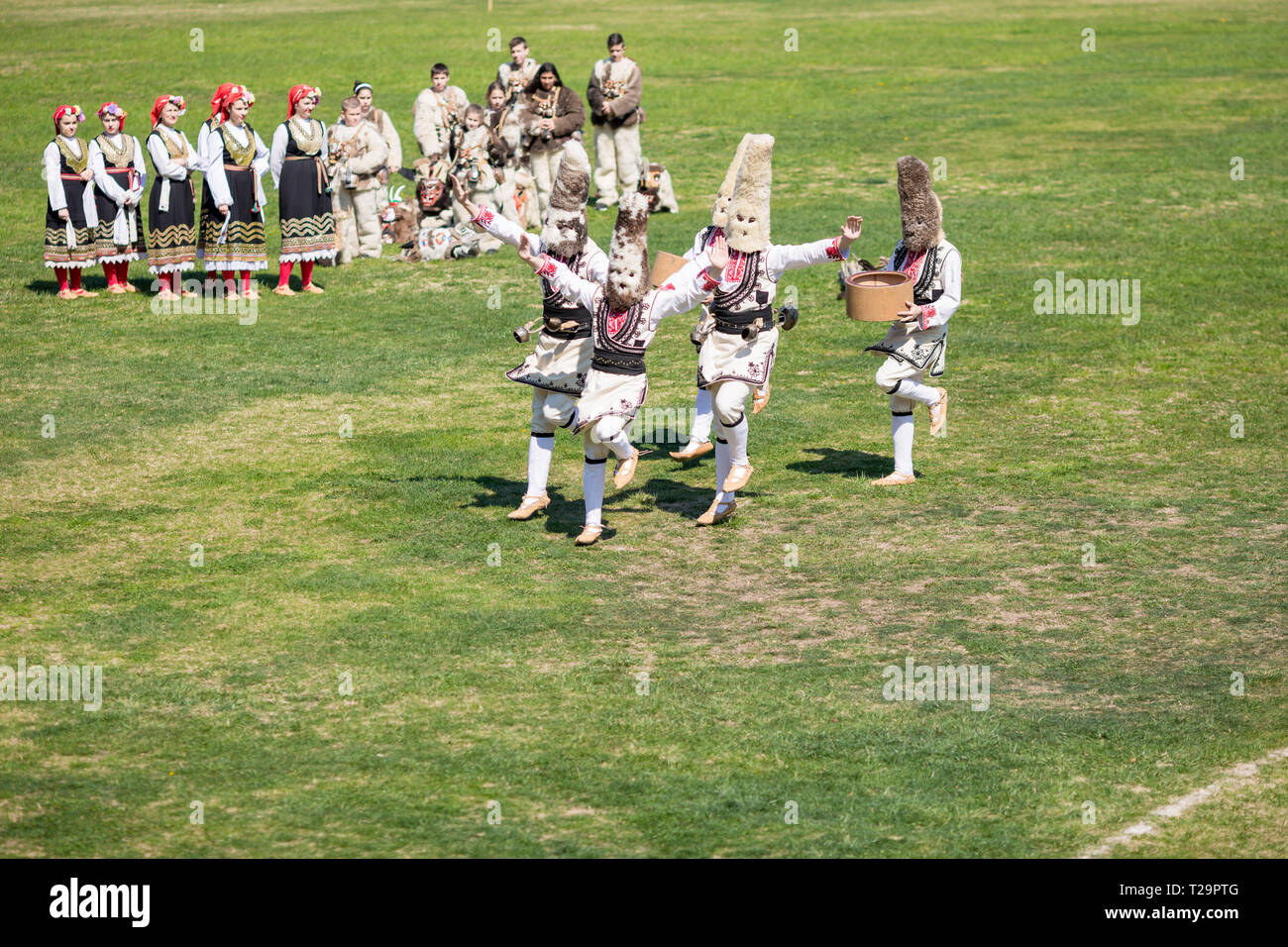 VARVARA, BULGARIA - MARCH 24, 2019: Moment from National Festival Dervish Varvara presents traditions of Bulgarian Kuker Games. Performers present the Stock Photo
