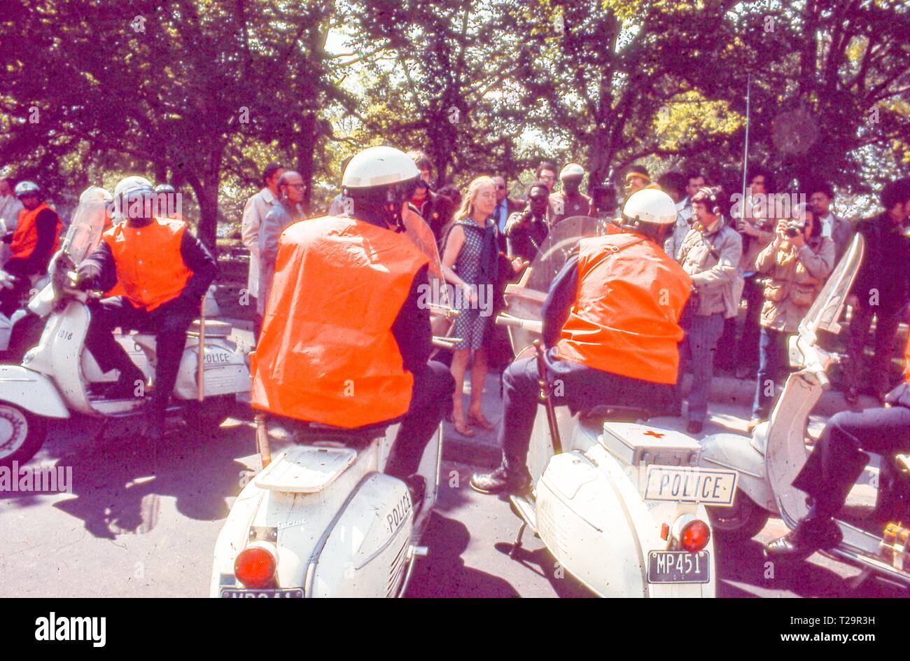 During the 1971 May Day Protests against the Vietnam War located, protesters in hippie attire face off against several motorcycle police officers, in Washington, DC, May 1971. () Stock Photo
