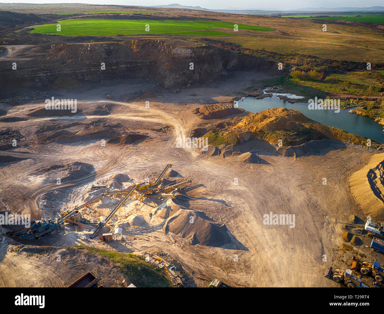 Panoramic view at sunset of gravel quarry,mining of yellow construction