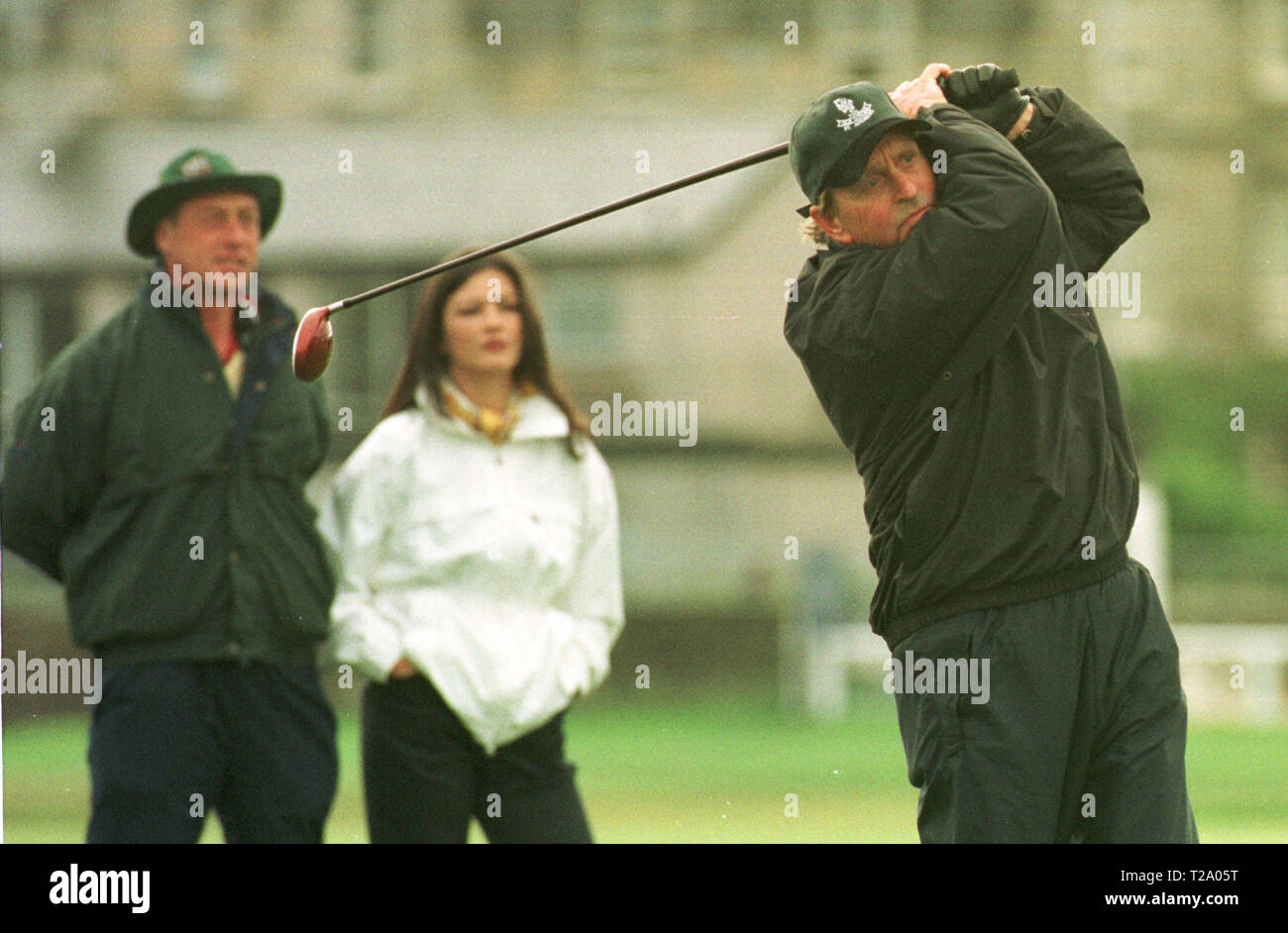 Catherine Zeta-Jones watches husband Michael Douglas tee shot on the 2nd hole at the Old Course, St. Andrews during the actor's round at the annual Dunhill pro-celebrity golf tournament where he partnered Ernie Els. Stock Photo