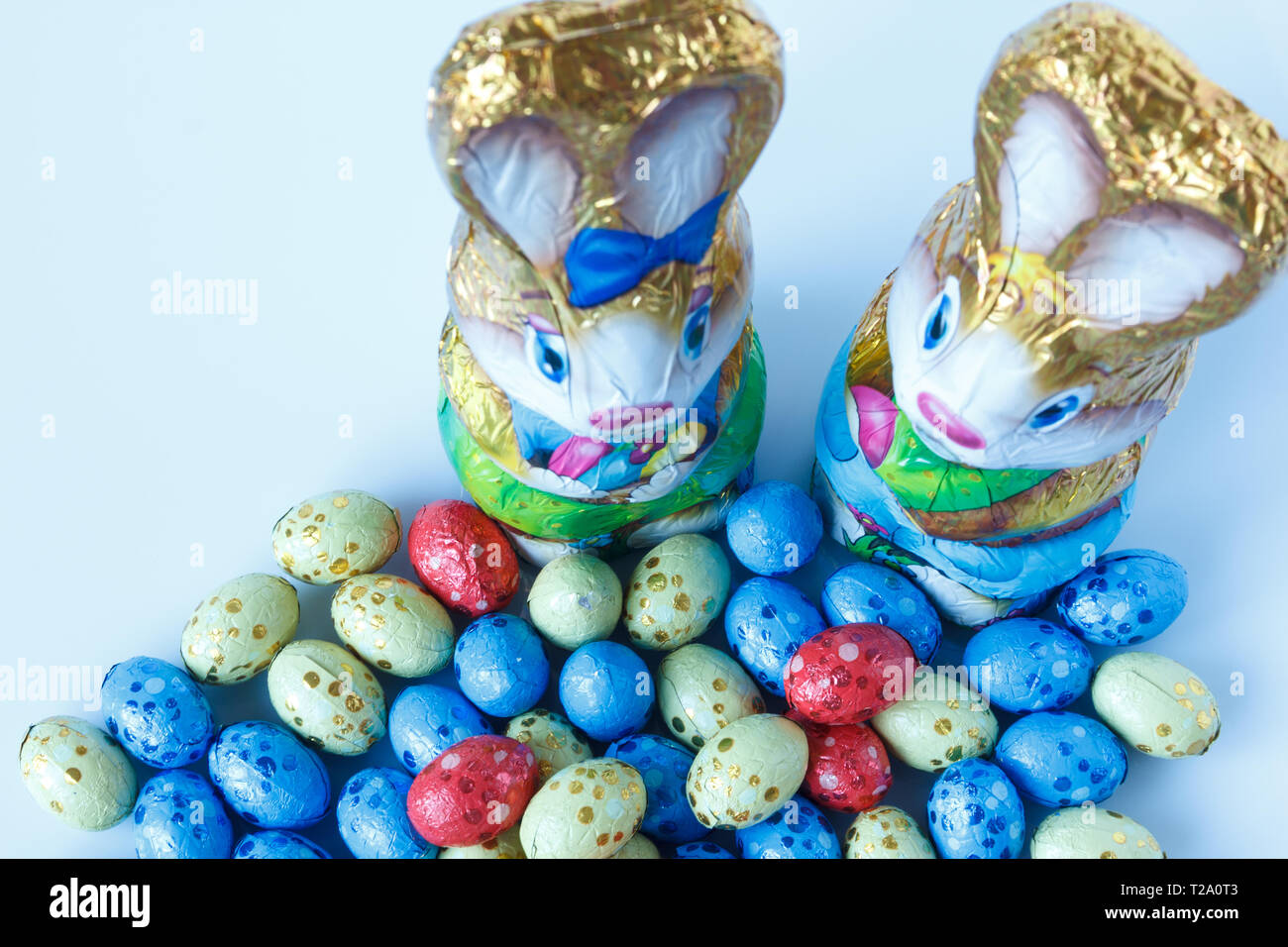 Two chocolate easter bunnies and chocolate easter eggs Stock Photo