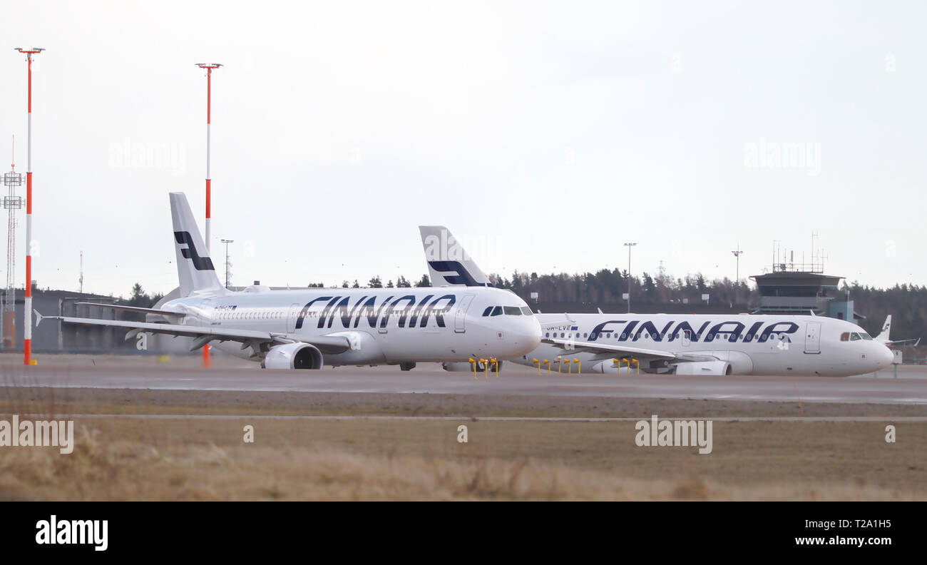 Two Finnair's planes, Airbus A319-112 and Airbus A321-211 standing in takeoff line at Helsinki-Vantaa airport. 26.04.2018 Vantaa Stock Photo