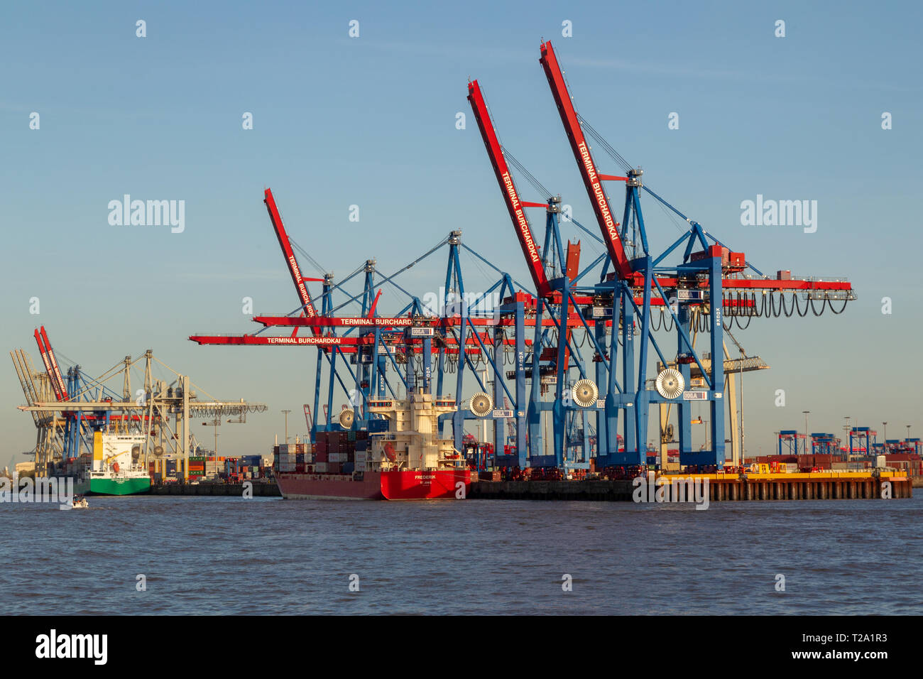 View from the river Elbe towards Terminal Burchardkai in the container harbor in Hamburg, Germany. Stock Photo