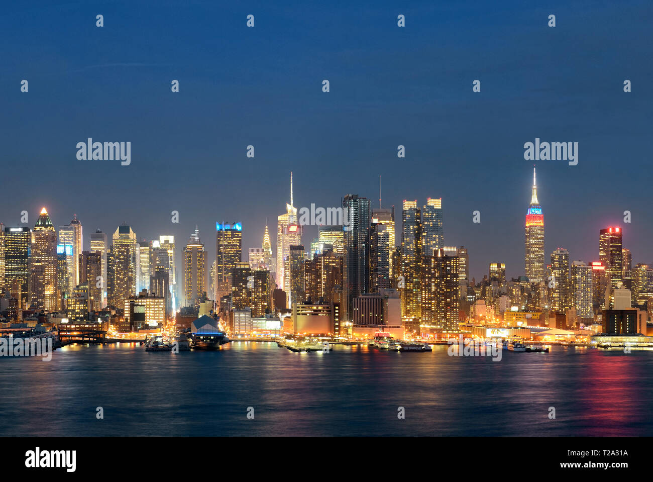Midtown skyline over Hudson River in New York City with skyscrapers at ...