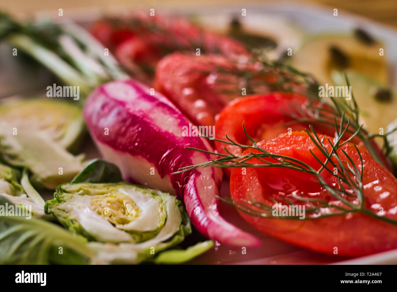 Salad with fresh vegetables from organic farming. A tasty meal to follow a healthy lifestyle. An ideal dish for vegetarians and vegans Stock Photo