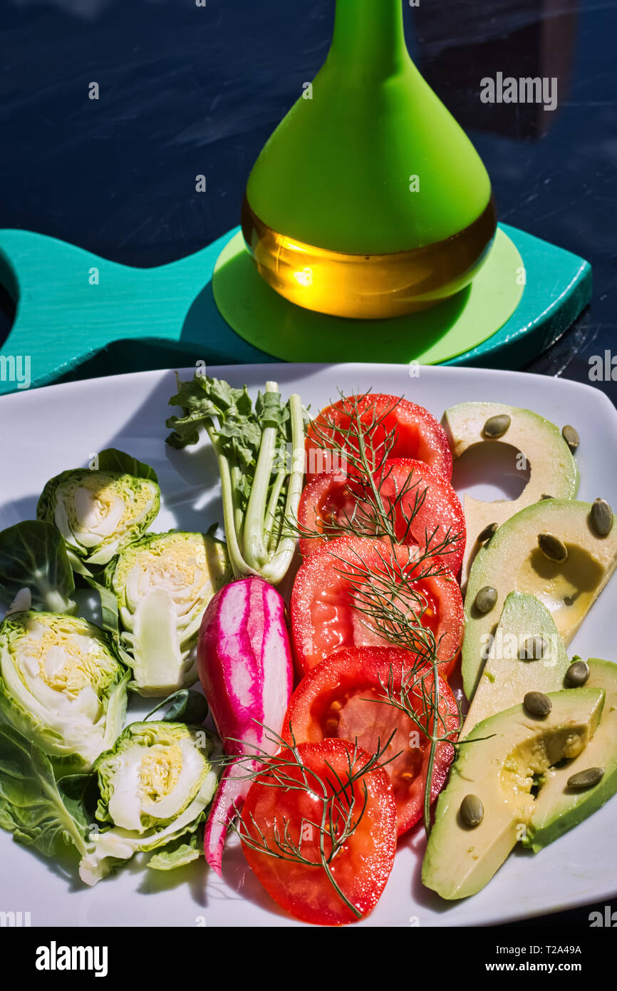 Salad with fresh vegetables from organic farming. A tasty meal to follow a healthy lifestyle. An ideal dish for vegetarians and vegans Stock Photo